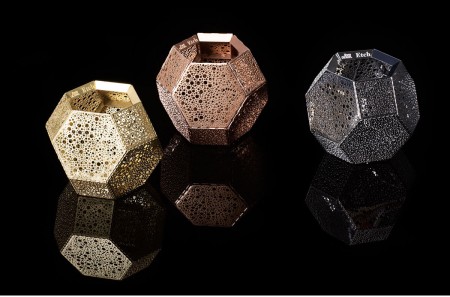 The Tom Dixon Etch Tea Light has detailed patterns cut directly onto the metal, creating a mass of intricate shadows when lit. 