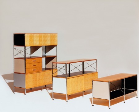 The steel cross-supports and uprights give the units an industrial feel and the dimpled plywood on cabinet fronts and plywood drawer fronts and shelves reinforce the furniture's mid-century modern appearance.