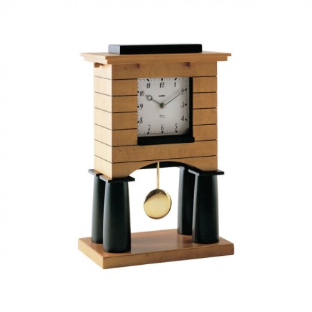 A clock as a work of architecture! Designed in 2013 the Mantel Pendulum Clock in maple-veneered wood has a quartz movement. The Graves Mantel Clock is a small, domestic work of architecture made entirely by hand and it fascinates us with its many construction details. 