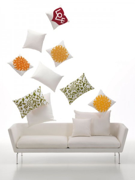 The Vitra Suita Two-Seater Sofa, designed by Antonio Citterio, 2010, takes the classic sofa and gives it a contemporary, lightweight, yet industrial and technical look. The clear lines of the body and the soft-worked paddings seem to float on top of the bridge-like feet made of polished aluminium.