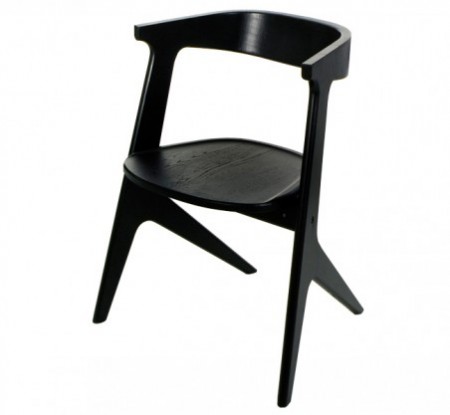 A solid oak chair finished in black or natural coloured lacquer. The Slab Chair was born out of the need for a stack-able, space-saving armchair.