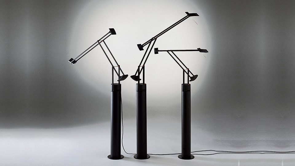 Here shown with its cool floor support that turns it into a floor light, the Tizio Classic, designed by Richard Sapper, 1972, is available as a Tizio Micro, Tizio 35, Tizio Classic and Tizio Plus. 