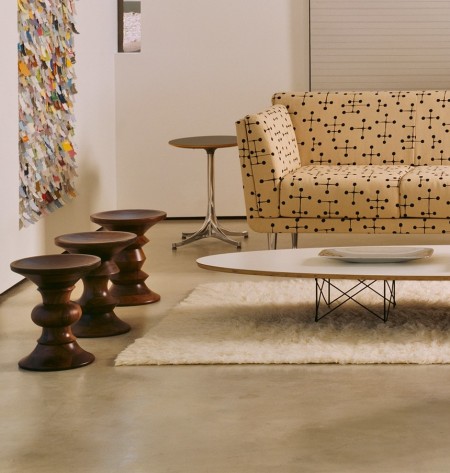 The Eames walnut stools are available in three distinctively different sculpted profiles.