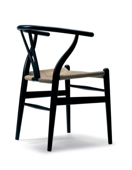 The Carl Hansen Wishbone Chair, designed by Hans J. Wegner in 1949, is perhaps Wegner's most celebrated work. A light, attractive and comfortable dining chair with the characteristic Y-shaped back and hand-woven seat.