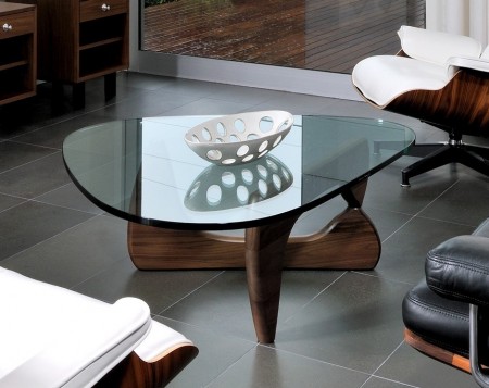 Isamu Noguchi's signature appears on the edge of the glass top. Base finishes are black, walnut, cherry and white ash.