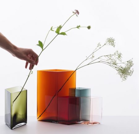 Each Ruutu vase is unique - mouth-blown into a steel mould and polished by hand. Designer engraving on the bottom of the vase. Difficult shape and intensive colours of the Ruutu vases require very skillfull craftsmen to work during 24 hour production process of one vase. It takes 7 craftsmen to blow one vase. The fluidity of mouth blown glass and the vibrant quality of the flat surfaces create an elegant combination with the geometric shape.