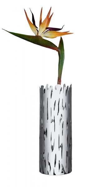 The Alessi Barkvase Flower Vase designed by Michael Boucquillon and Donia Maaoui inspiered by the trees that surround their house in Lucca. The flower vase is produced at the factory in Crusinallo, Omegna, using a cutting and laser perforating process on the steel sheet, which is subsequently shaped and welded. The design of  "Barkvase", as its name suggests, is inspired by tree bark and its perforated pattern recalls knots in the wood grain.