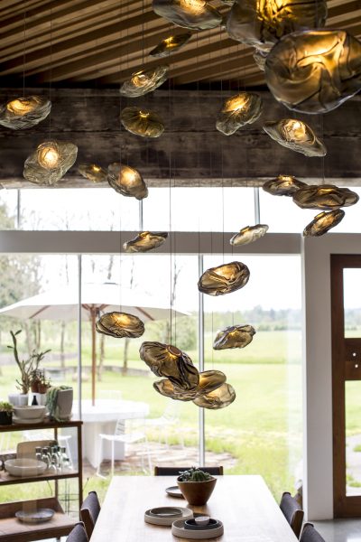 The 73 series is a cloud-like pendant, each formed in unexpected ways. The pendants is hand blown into a folded and highly heat-resistant ceramic fabric vessel and is housed with a 2.3-watt ring LED lamp which fills the volume of the pendant with diffuse light.